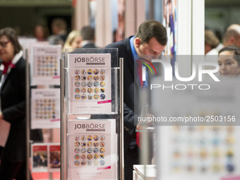 People attend a Job Fair for Refugees and Migrants in Berlin, Germany on February 20, 2018. With over 200 exhibitors and around 3000 job off...