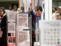 People attend a Job Fair for Refugees and Migrants in Berlin, Germany on February 20, 2018. With over 200 exhibitors and around 3000 job off...