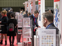 People attend a Job Fair for Refugees and Migrants in Berlin, Germany on February 20, 2018. With over 200 exhibitors and around 3000 job off...