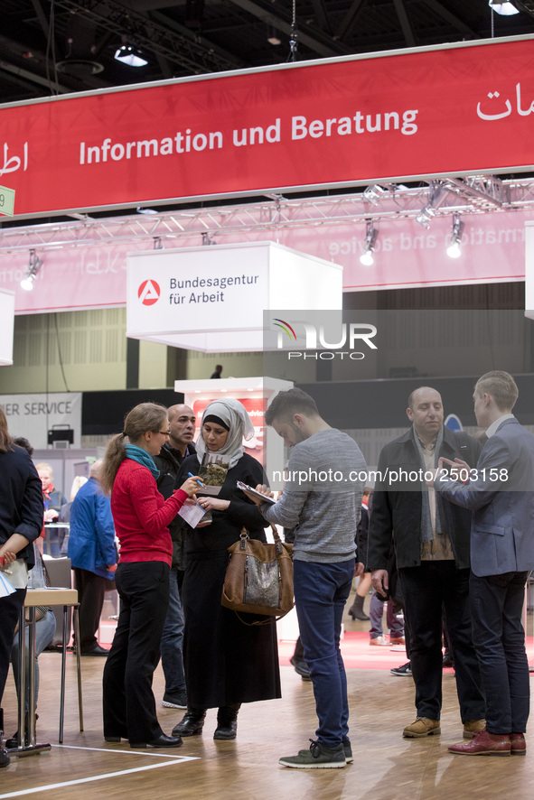 People attend a Job Fair for Refugees and Migrants in Berlin, Germany on February 20, 2018. With over 200 exhibitors and around 3000 job off...