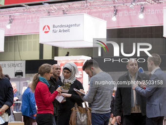 People attend a Job Fair for Refugees and Migrants in Berlin, Germany on February 20, 2018. With over 200 exhibitors and around 3000 job off...