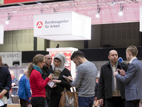 People attend a Job Fair for Refugees and Migrants in Berlin, Germany on February 20, 2018. With over 200 exhibitors and around 3000 job off...