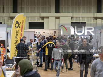 People attend a Job Fair for Refugees and Migrants in Berlin, Germany on February 20, 2018. With over 200 exhibitors and around 3000 job off...