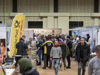 People attend a Job Fair for Refugees and Migrants in Berlin, Germany on February 20, 2018. With over 200 exhibitors and around 3000 job off...