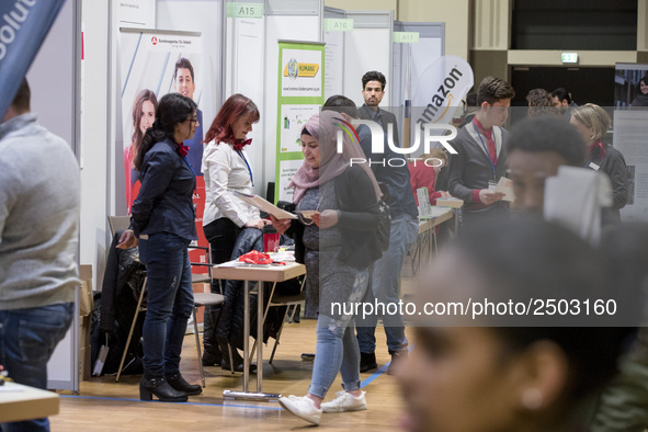 People attend a Job Fair for Refugees and Migrants in Berlin, Germany on February 20, 2018. With over 200 exhibitors and around 3000 job off...