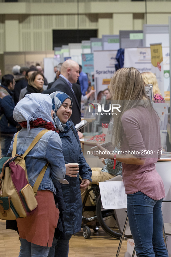 People attend a Job Fair for Refugees and Migrants in Berlin, Germany on February 20, 2018. With over 200 exhibitors and around 3000 job off...