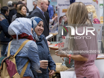 People attend a Job Fair for Refugees and Migrants in Berlin, Germany on February 20, 2018. With over 200 exhibitors and around 3000 job off...