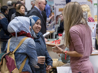 People attend a Job Fair for Refugees and Migrants in Berlin, Germany on February 20, 2018. With over 200 exhibitors and around 3000 job off...