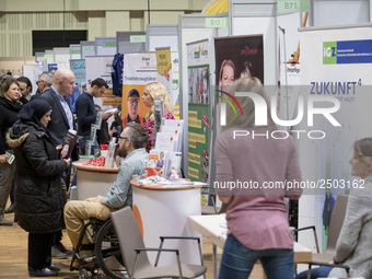 People attend a Job Fair for Refugees and Migrants in Berlin, Germany on February 20, 2018. With over 200 exhibitors and around 3000 job off...