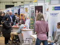 People attend a Job Fair for Refugees and Migrants in Berlin, Germany on February 20, 2018. With over 200 exhibitors and around 3000 job off...