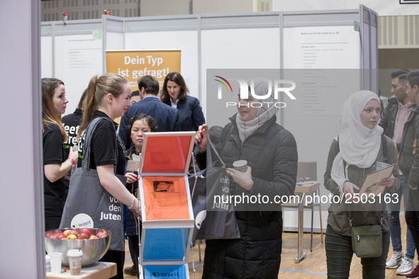 People attend a Job Fair for Refugees and Migrants in Berlin, Germany on February 20, 2018. With over 200 exhibitors and around 3000 job off...