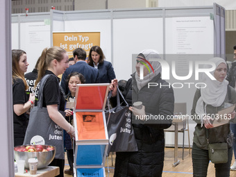 People attend a Job Fair for Refugees and Migrants in Berlin, Germany on February 20, 2018. With over 200 exhibitors and around 3000 job off...