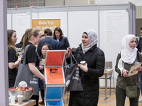 People attend a Job Fair for Refugees and Migrants in Berlin, Germany on February 20, 2018. With over 200 exhibitors and around 3000 job off...