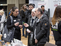 People attend a Job Fair for Refugees and Migrants in Berlin, Germany on February 20, 2018. With over 200 exhibitors and around 3000 job off...