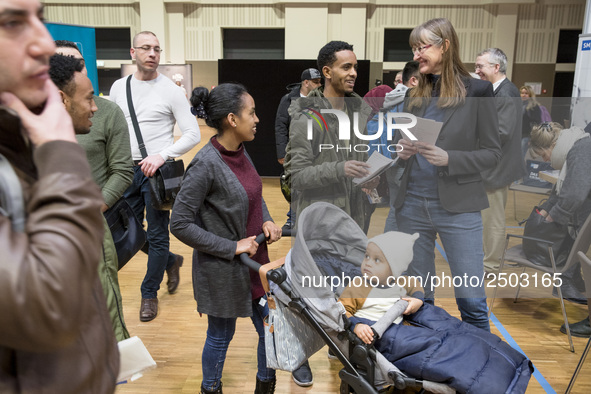 People attend a Job Fair for Refugees and Migrants in Berlin, Germany on February 20, 2018. With over 200 exhibitors and around 3000 job off...