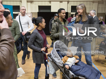 People attend a Job Fair for Refugees and Migrants in Berlin, Germany on February 20, 2018. With over 200 exhibitors and around 3000 job off...