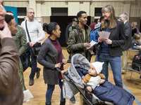 People attend a Job Fair for Refugees and Migrants in Berlin, Germany on February 20, 2018. With over 200 exhibitors and around 3000 job off...