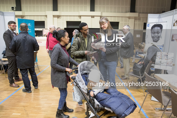 People attend a Job Fair for Refugees and Migrants in Berlin, Germany on February 20, 2018. With over 200 exhibitors and around 3000 job off...