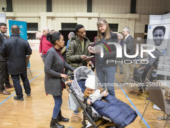 People attend a Job Fair for Refugees and Migrants in Berlin, Germany on February 20, 2018. With over 200 exhibitors and around 3000 job off...