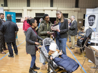 People attend a Job Fair for Refugees and Migrants in Berlin, Germany on February 20, 2018. With over 200 exhibitors and around 3000 job off...