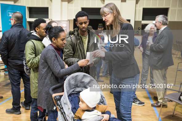 People attend a Job Fair for Refugees and Migrants in Berlin, Germany on February 20, 2018. With over 200 exhibitors and around 3000 job off...