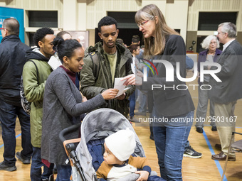 People attend a Job Fair for Refugees and Migrants in Berlin, Germany on February 20, 2018. With over 200 exhibitors and around 3000 job off...