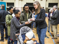 People attend a Job Fair for Refugees and Migrants in Berlin, Germany on February 20, 2018. With over 200 exhibitors and around 3000 job off...