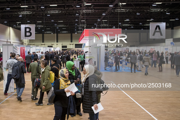 People attend a Job Fair for Refugees and Migrants in Berlin, Germany on February 20, 2018. With over 200 exhibitors and around 3000 job off...