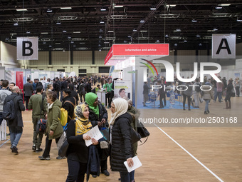 People attend a Job Fair for Refugees and Migrants in Berlin, Germany on February 20, 2018. With over 200 exhibitors and around 3000 job off...