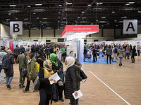 People attend a Job Fair for Refugees and Migrants in Berlin, Germany on February 20, 2018. With over 200 exhibitors and around 3000 job off...