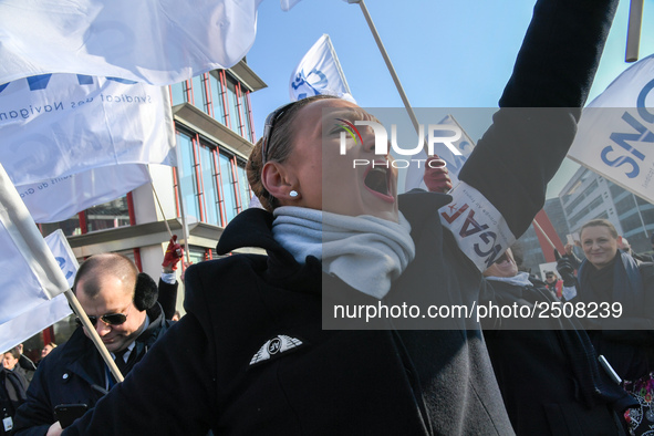 Striking Air France employees wave flags at Charles de Gaulle airport in Roissy, outside Paris, on February 22, 2018. Half of Air France's l...