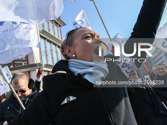 Striking Air France employees wave flags at Charles de Gaulle airport in Roissy, outside Paris, on February 22, 2018. Half of Air France's l...