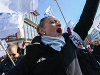 Striking Air France employees wave flags at Charles de Gaulle airport in Roissy, outside Paris, on February 22, 2018. Half of Air France's l...