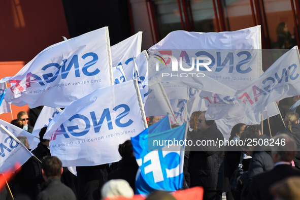 Striking Air France employees wave flags at Charles de Gaulle airport in Roissy, outside Paris, on February 22, 2018. Half of Air France's l...