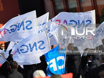 Striking Air France employees wave flags at Charles de Gaulle airport in Roissy, outside Paris, on February 22, 2018. Half of Air France's l...