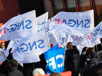 Striking Air France employees wave flags at Charles de Gaulle airport in Roissy, outside Paris, on February 22, 2018. Half of Air France's l...