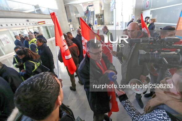 Air France FO union secretary Christophe Malloggi (C) speaks to journalists during a coordinated one-day strike involving Air France pilots,...