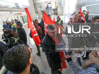 Air France FO union secretary Christophe Malloggi (C) speaks to journalists during a coordinated one-day strike involving Air France pilots,...