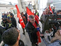 Air France FO union secretary Christophe Malloggi (C) speaks to journalists during a coordinated one-day strike involving Air France pilots,...