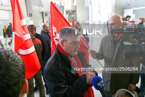 Air France FO union secretary Christophe Malloggi (C) speaks to journalists during a coordinated one-day strike involving Air France pilots,...