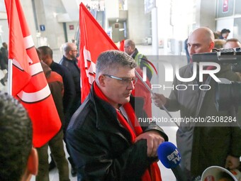 Air France FO union secretary Christophe Malloggi (C) speaks to journalists during a coordinated one-day strike involving Air France pilots,...