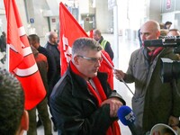 Air France FO union secretary Christophe Malloggi (C) speaks to journalists during a coordinated one-day strike involving Air France pilots,...