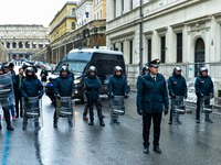 Italian police controls the Logistic and transport workers from COBAS union during a protest against the so-called 'jobs-act' law in Rome, I...