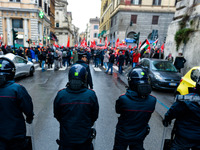 Italian police controls the Logistic and transport workers from COBAS union during a protest against the so-called 'jobs-act' law in Rome, I...