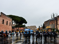 Italian police controls the Logistic and transport workers from COBAS union during a protest against the so-called 'jobs-act' law in Rome, I...