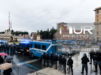 Italian police controls the Logistic and transport workers from COBAS union during a protest against the so-called 'jobs-act' law in Rome, I...