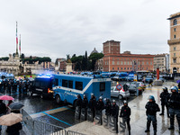 Italian police controls the Logistic and transport workers from COBAS union during a protest against the so-called 'jobs-act' law in Rome, I...