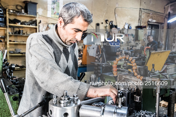 Workers are processing metal to make fasteners for industrial use in a old "han" factory in Istanbul, Turkey, 25 February 2018. This buildin...