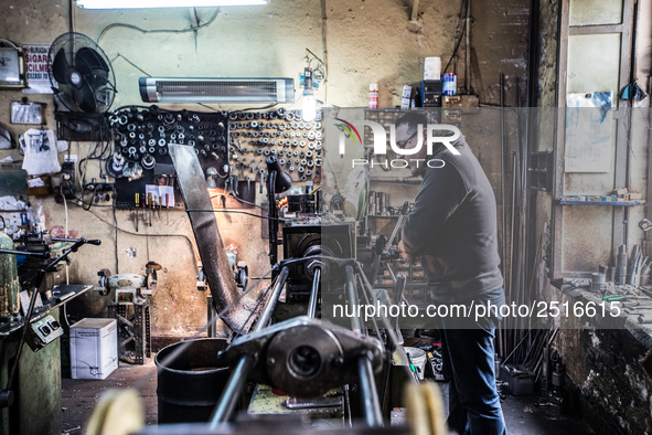 Workers are processing metal to make fasteners for industrial use in a old "han" factory in Istanbul, Turkey, 25 February 2018. This buildin...