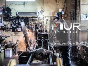 Workers are processing metal to make fasteners for industrial use in a old "han" factory in Istanbul, Turkey, 25 February 2018. This buildin...